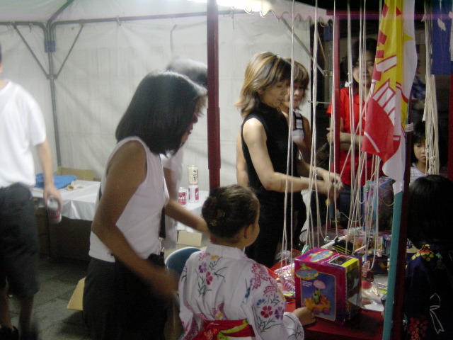 Yoko at our building's money-raising toy booth